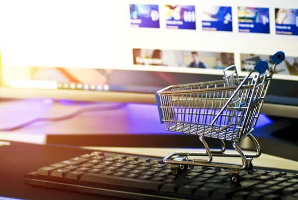 mini shopping cart on computer keyboard