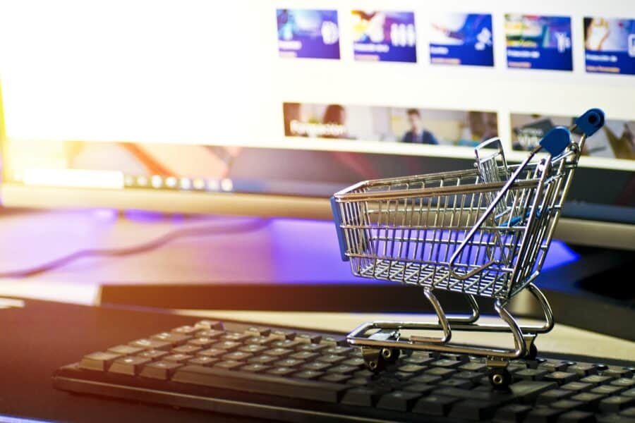mini shopping cart on computer keyboard
